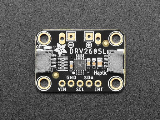 Video of a haptic controller breakout board with a vibrating motor disc soldered to it. The disc vibrates against the surface.