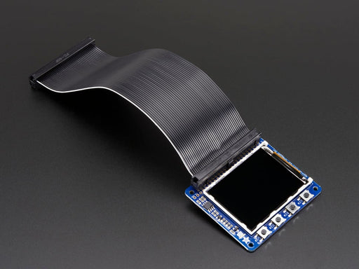 Top down view of a Adafruit PiTFT 2.2" HAT Mini Kit with desktop image on the display. 