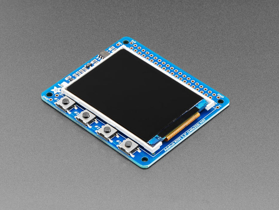 Top down view of a Adafruit PiTFT 2.2" HAT Mini Kit with desktop image on the display. 