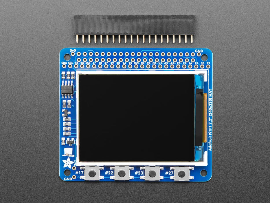 Top down view of a Adafruit PiTFT 2.2" HAT Mini Kit with desktop image on the display. 