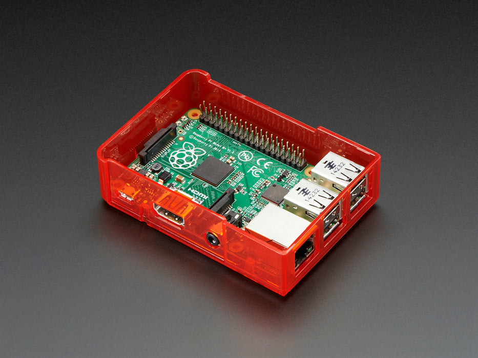 Assembled red acrylic Raspberry Pi case with no lid.