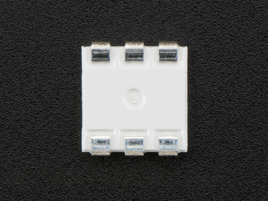 Top down view of a 5050 Warm White LED w/ Integrated Driver Chip. 