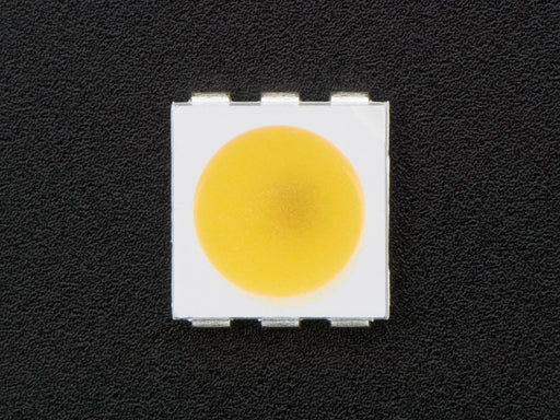 Top down view of a 5050 Warm White LED w/ Integrated Driver Chip. 