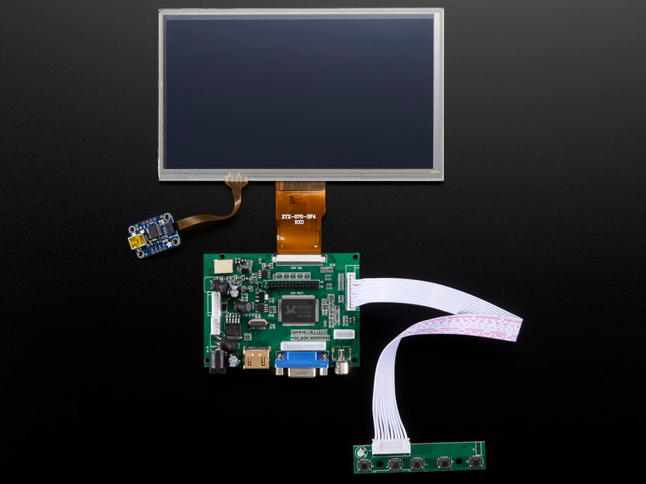 Front shot of a HDMI 4 Pi: 7" Display connected to a Raspberry Pi. The monitor displays a desktop background with a adafruit logo, raspberry logo, and a heart. 