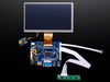 Front shot of a HDMI 4 Pi: 7" Display connected to a Raspberry Pi. The monitor displays a desktop background with a adafruit logo, raspberry logo, and a heart. 