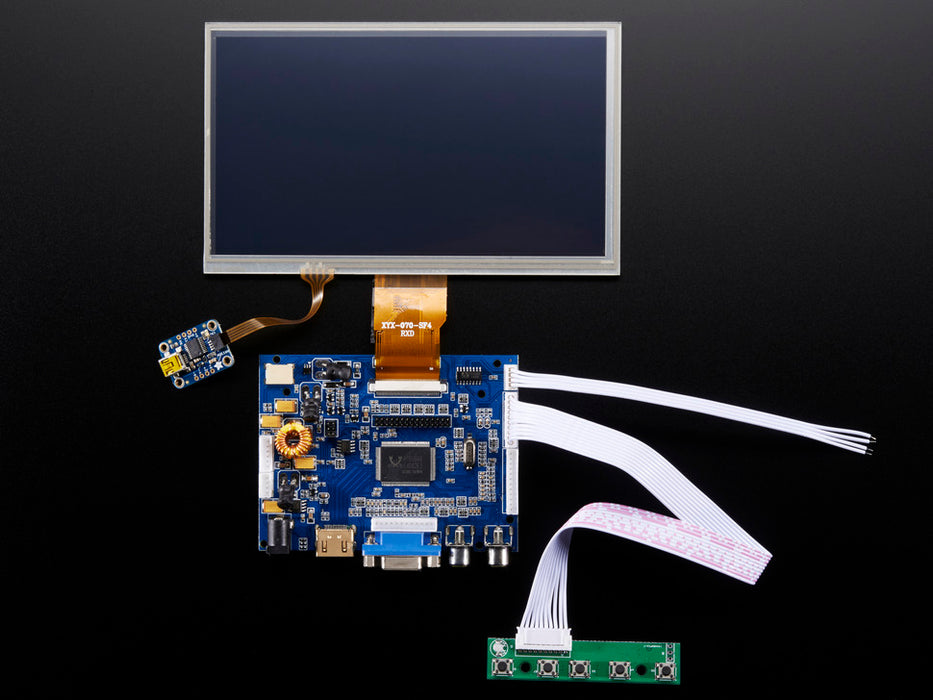 Front shot of a HDMI 4 Pi: 7" Display connected to a Raspberry Pi. The monitor displays a desktop background with a adafruit logo, raspberry logo, and a heart. 