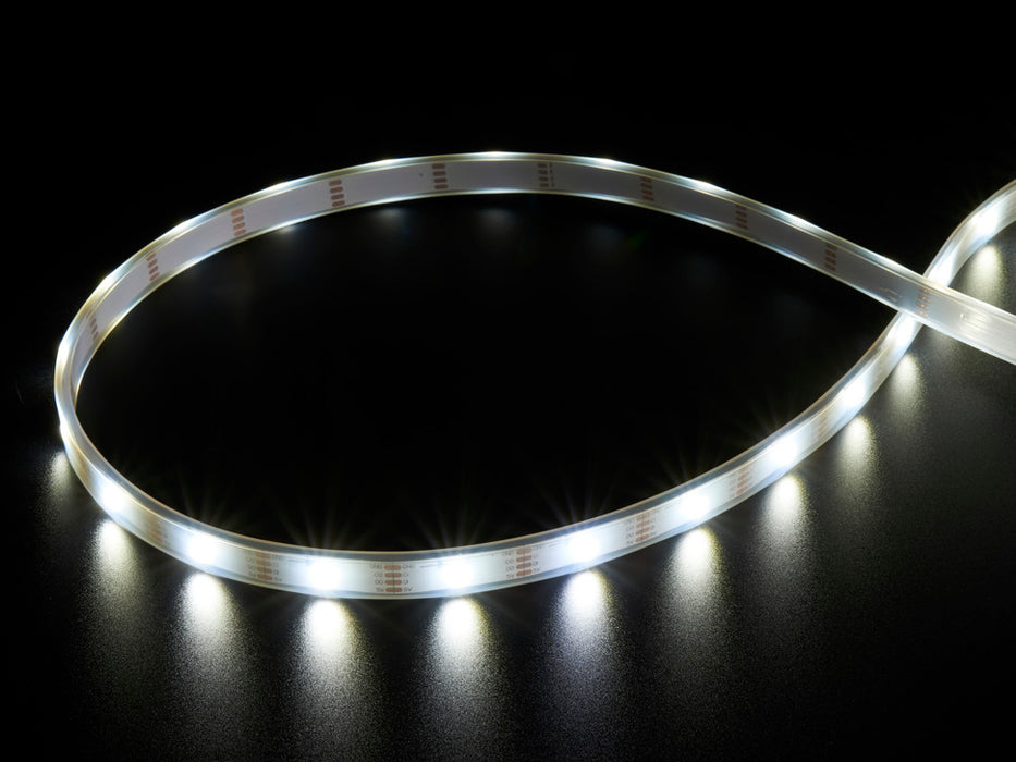 Video of Part of a coiled LED strip fading in and out glowing white LEDs.