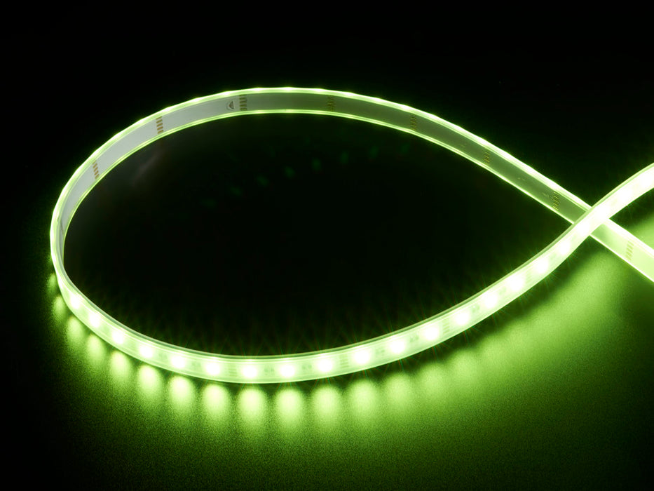 Coiled warm white LED strip with LEDs changing color throughout rainbow and also white