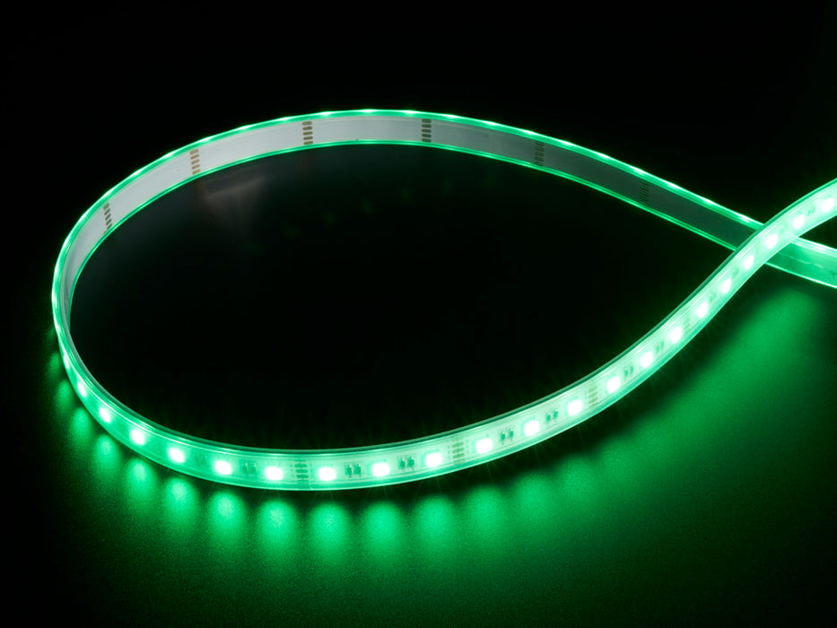 Coiled cool white LED strip with LEDs changing color throughout rainbow and also white