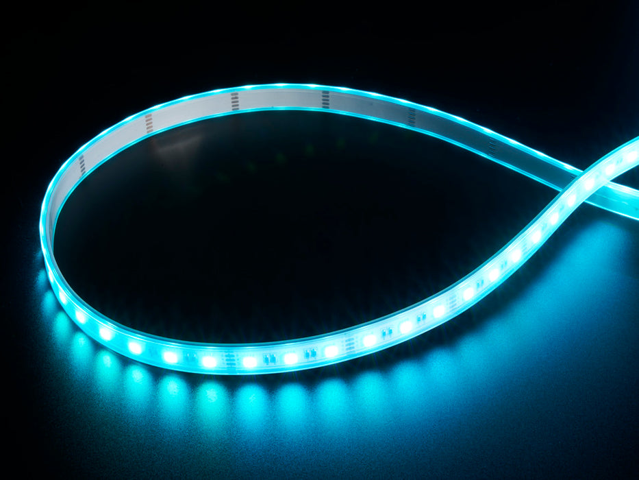 Coiled cool white LED strip with LEDs changing color throughout rainbow and also white