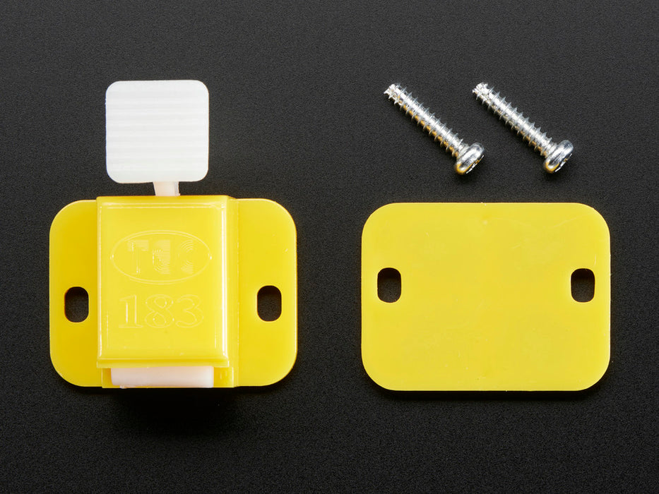 Angled shot of a yellow Fixture Clip. 