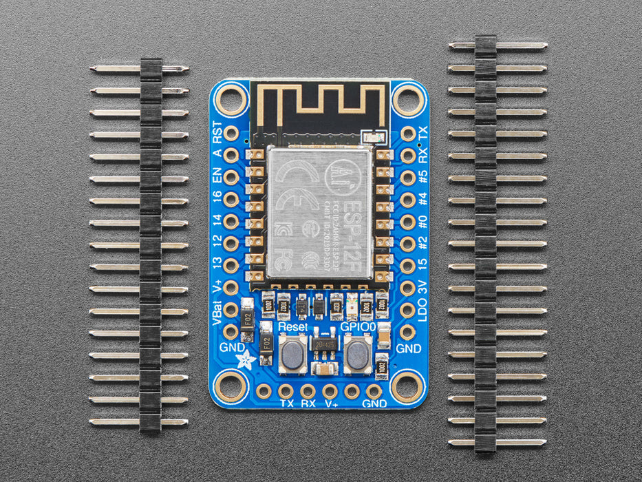 Angled shot of a Adafruit HUZZAH ESP8266 Breakout. 