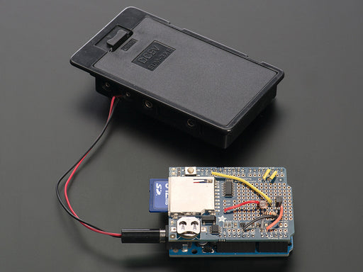 Top down view of components included in a Light and temperature data-logger pack.