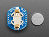 Angled shot of a ChronoDot - Ultra-precise Real Time Clock with a cell battery inserted. 