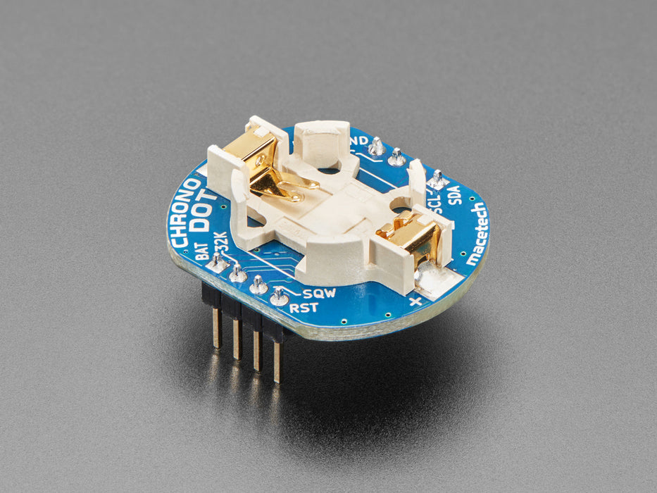 Angled shot of a ChronoDot - Ultra-precise Real Time Clock with a cell battery inserted. 