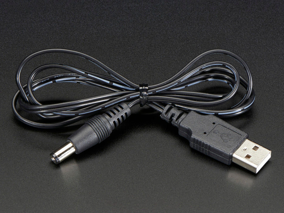 Shot of a coiled USB to 2.1mm Male Barrel Jack Cable.