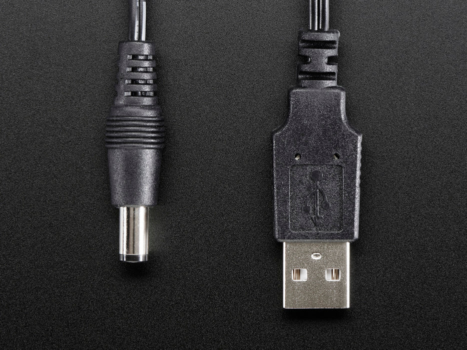 Shot of a coiled USB to 2.1mm Male Barrel Jack Cable.