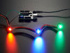 Animation of three very bright chained LEDs all changing rainbow colors