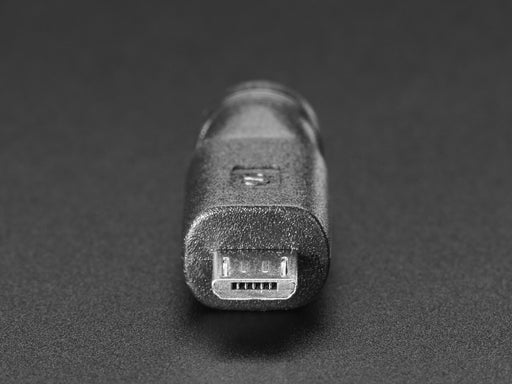 Angled shot of a MicroUSB to 5.5/2.1mm DC Barrel Jack Adapter showing DC Barrel Jack end.