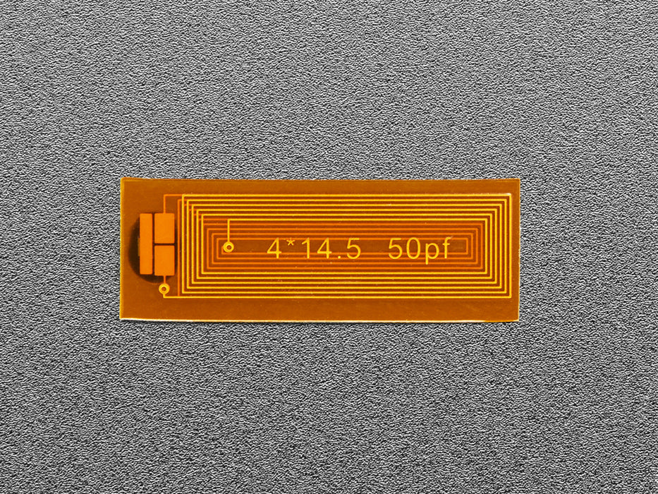 Miniature flexible RFID tag on top of quarter