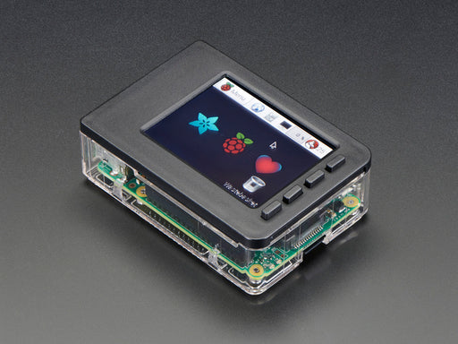 Red polished white hand holding a Faceplate and Buttons Pack placed on a Pi. 