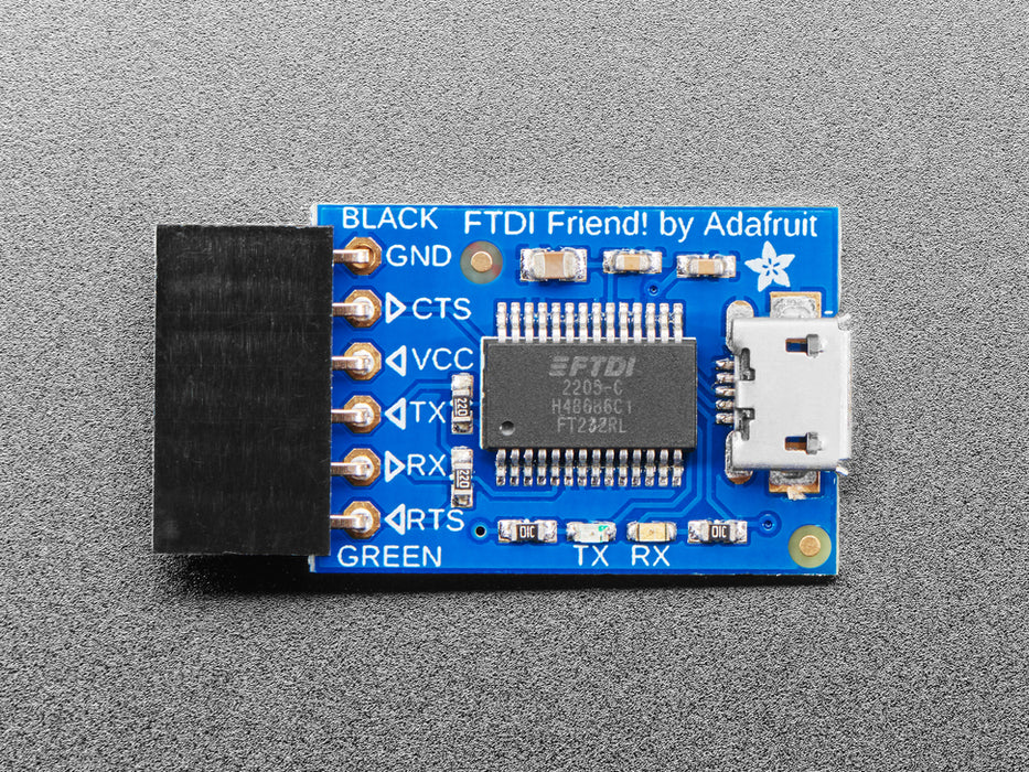 Angled shot of blue rectangular FTDI breakout board.