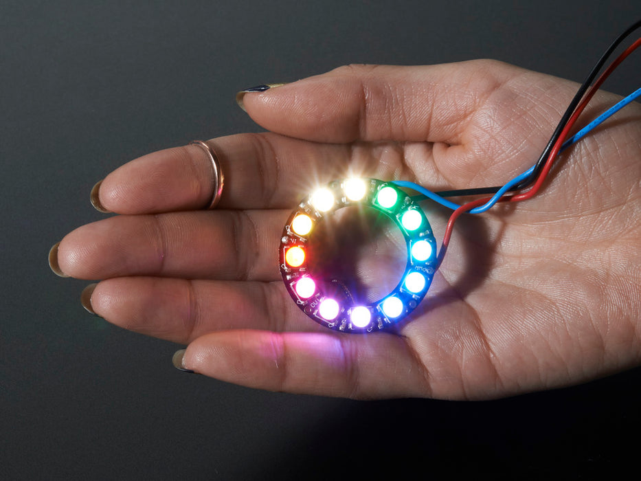 NeoPixel Ring with 12 x 5050 RGBW LEDs lighting up rainbow and white