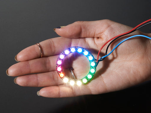 NeoPixel Ring with 16 x 5050 RGBW LEDs lighting up rainbow and white