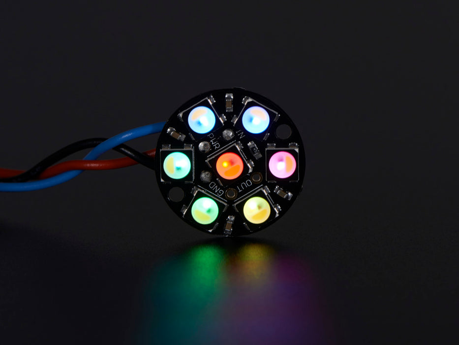 NeoPixel Jewel - 7 x 5050 RGB LED wired to Trinket, lit up rainbow and white