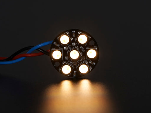 NeoPixel Jewel - 7 x 5050 RGB LED wired to Trinket, lit up rainbow and white