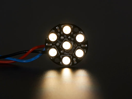 NeoPixel Jewel - 7 x 5050 RGB LED wired to Trinket, lit up rainbow and white