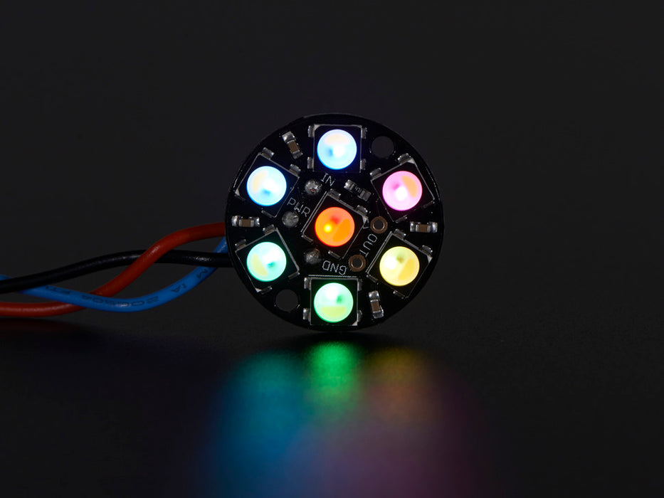 NeoPixel Jewel - 7 x 5050 RGB LED wired to Trinket, lit up rainbow and white