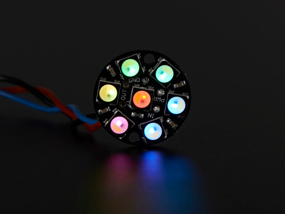 NeoPixel Jewel - 7 x 5050 RGB LED wired to Trinket, lit up rainbow and white