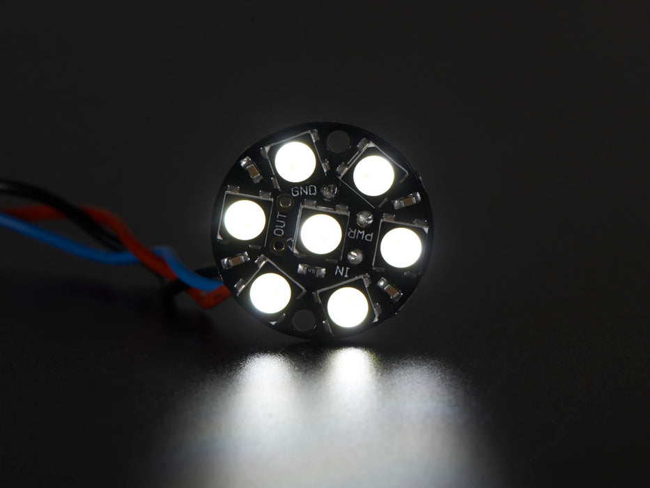 NeoPixel Jewel - 7 x 5050 RGB LED wired to Trinket, lit up rainbow and white