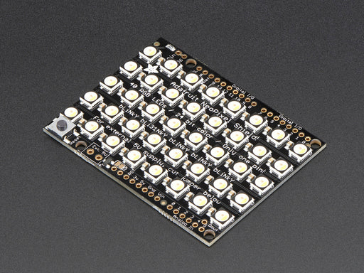 Adafruit NeoPixel Shield for Arduino - 40 RGB LED Pixel Matrix lit up rainbow and warm white.