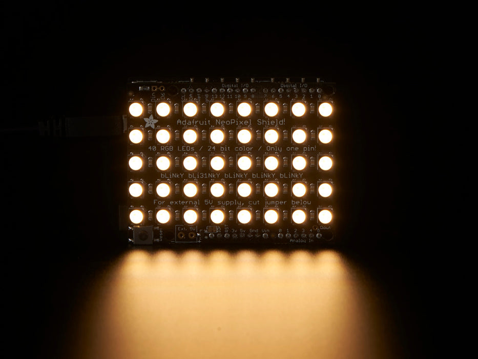 Adafruit NeoPixel Shield for Arduino - 40 RGB LED Pixel Matrix lit up rainbow and warm white.