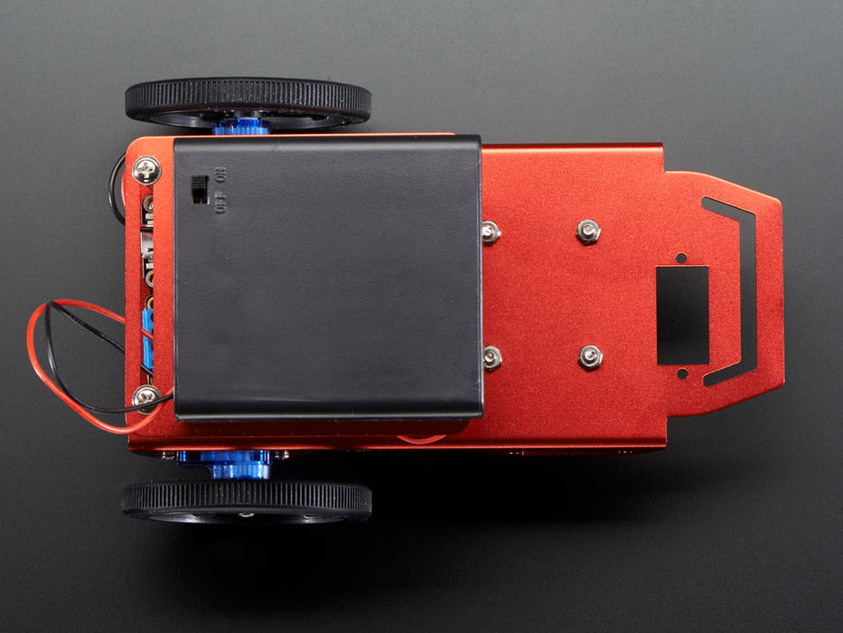 Two-wheeled robot turning around a few times and then driving off.