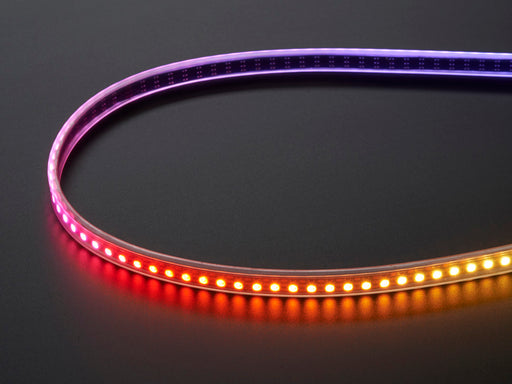 Adafruit NeoPixel Digital RGB LED Strip wired to a microcontroller, with all the LEDs in a rainbow