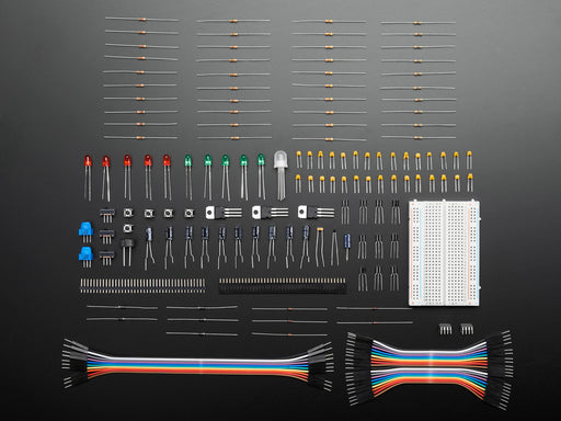 A plastic storage box full of various electrical components.