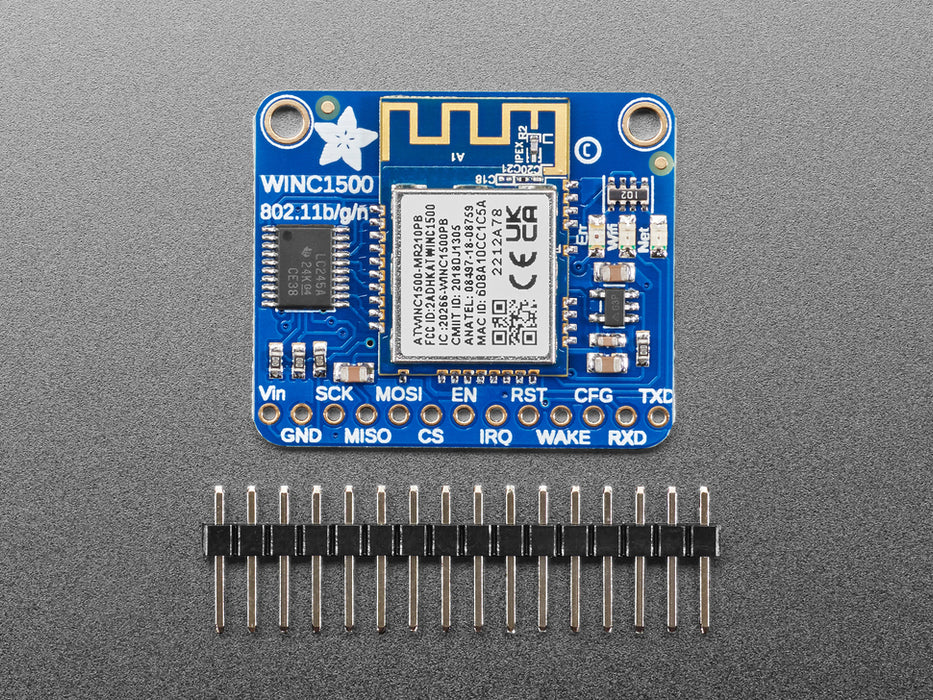 Angled shot of blue, square WiFi breakout board.