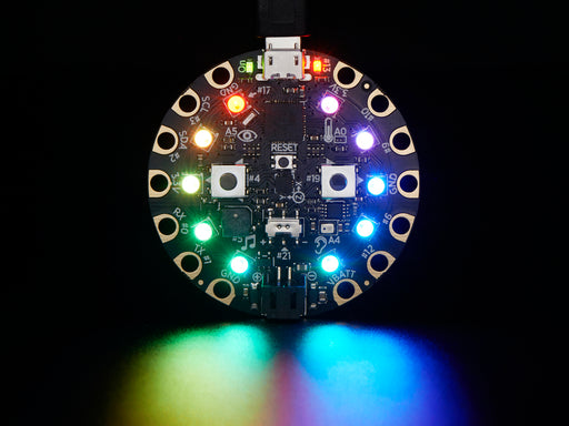 Video of a round microcontroller with lit up LEDs.