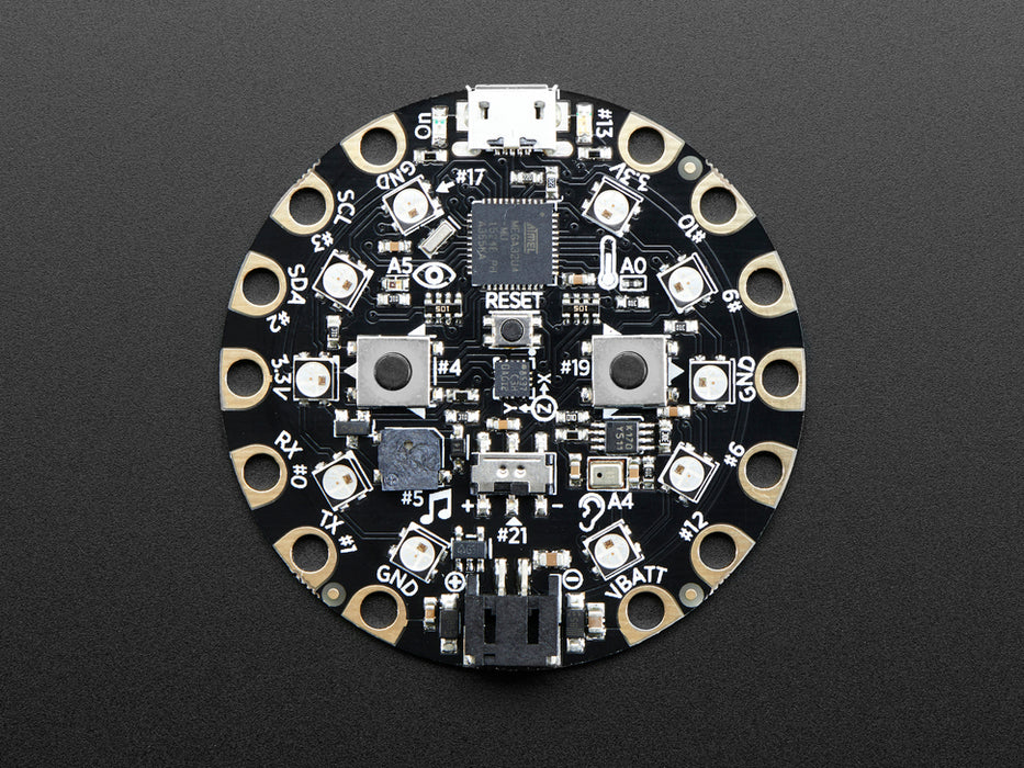 Video of a round microcontroller with lit up LEDs.