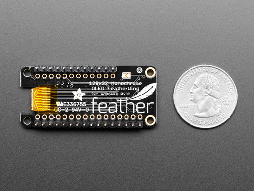 Angled shot of a Assembled Adafruit FeatherWing OLED - 128x32 OLED Add-on For Feather. 