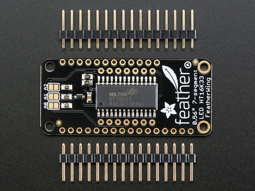 Angled shot of a Adafruit 4-Digit 7-Segment LED Matrix Display FeatherWing. 