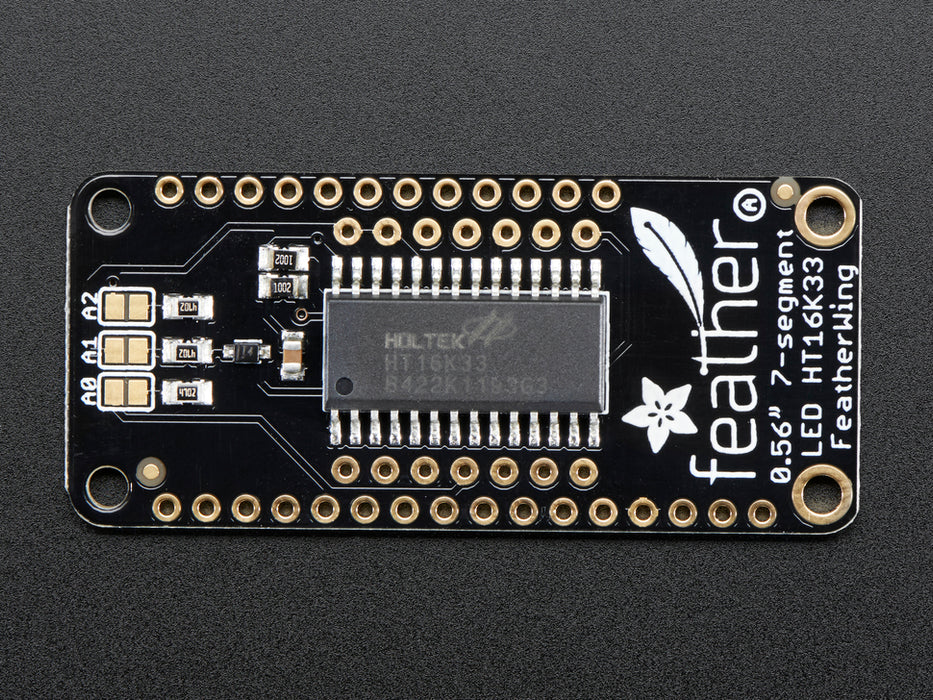 Angled shot of a Adafruit 4-Digit 7-Segment LED Matrix Display FeatherWing. 