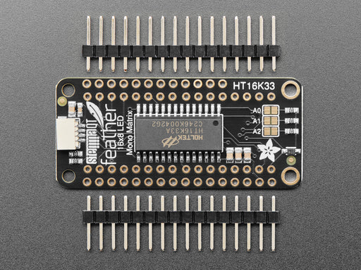 Angled shot of a Adafruit 8x16 LED Matrix FeatherWing w/o Matrices. 