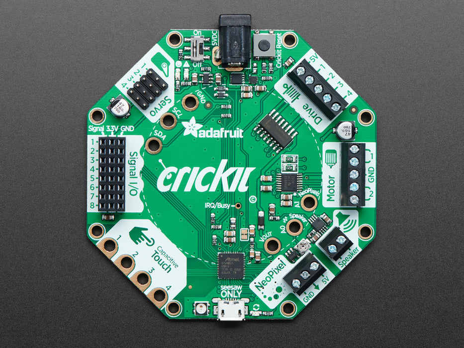 Top down view of a Adafruit CRICKIT for Circuit Playground Express with a circular board connected. 