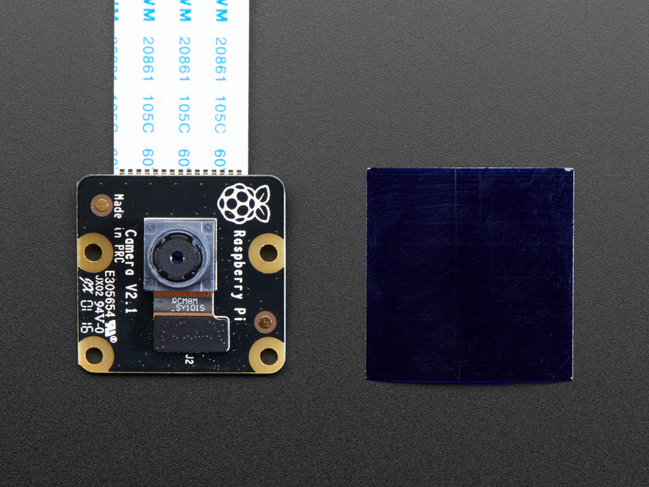 Angled shot of Raspberry Pi NoIR Camera Board v2 - 8 Megapixels connected to a Raspberry Pi via flex cable. 