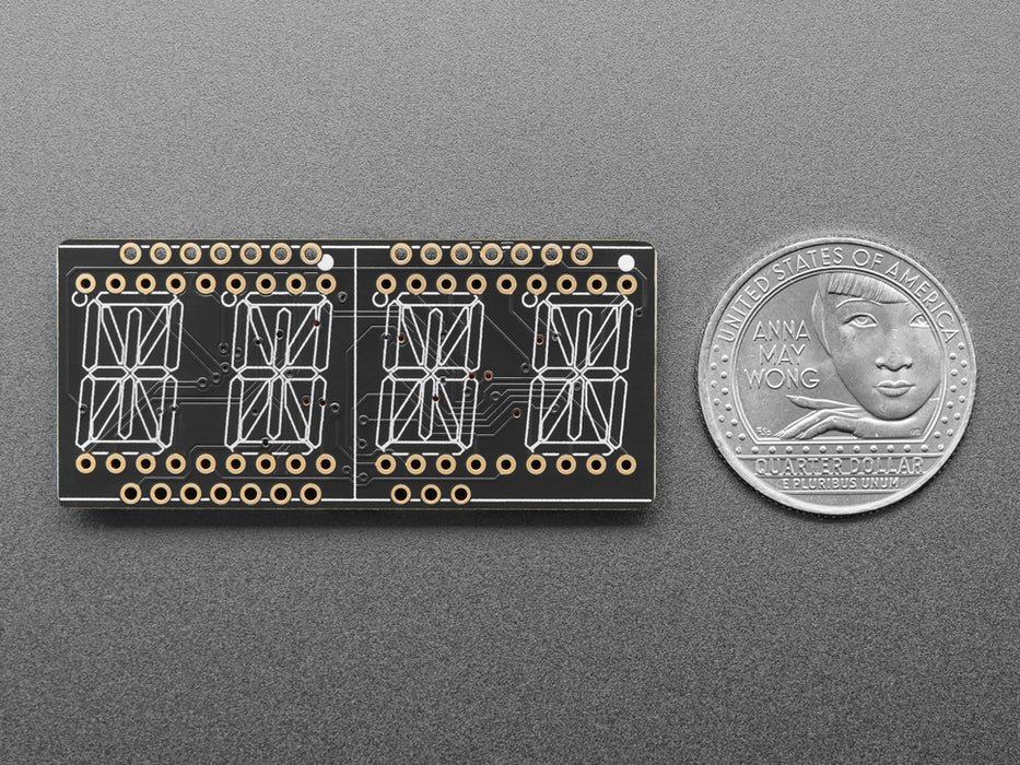 Angled shot of a rectangular shaped Quad Alphanumeric Display breakout board with an LED matrix soldered on.