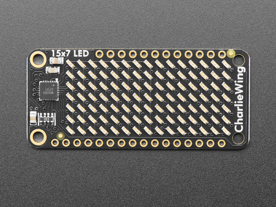 Video of a Adafruit 15x7 CharliePlex LED Matrix Display FeatherWing illuminating Yellow LEDs in a wave like pattern. 